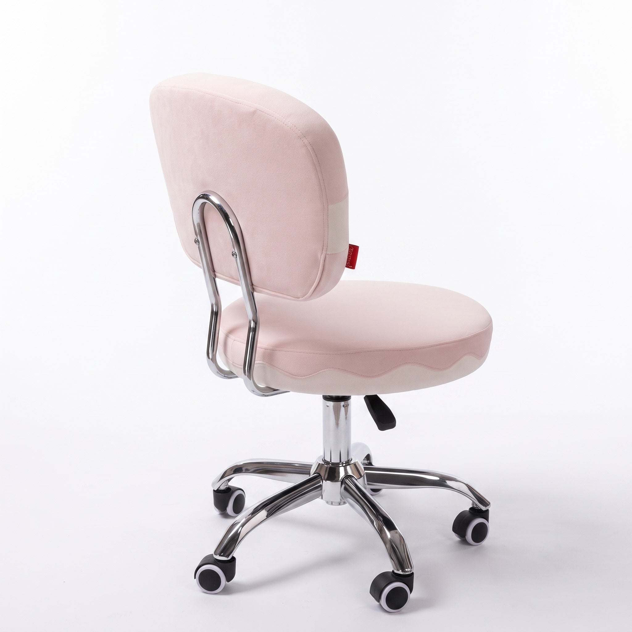The back of the pink vanity chair is displayed